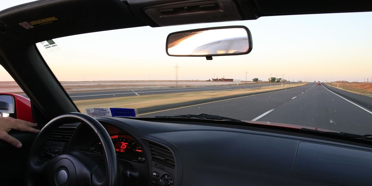 What Does That Tab on Your Rear View Mirror Really Do?