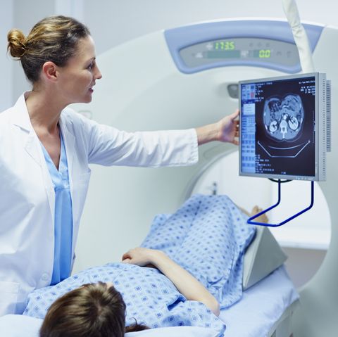 Doctor showing CT scan to patient