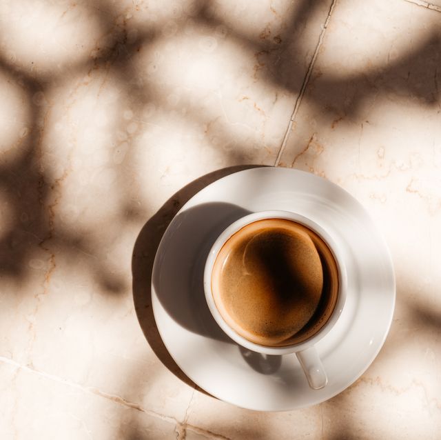 cup of aromatic coffee standing on an empty table