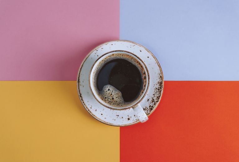 Cup of Coffee on colored background