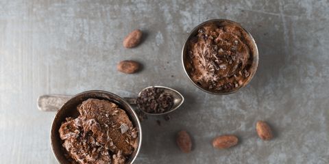 cups of chocolate icecream sprinkled with cacao and cacao nibs
