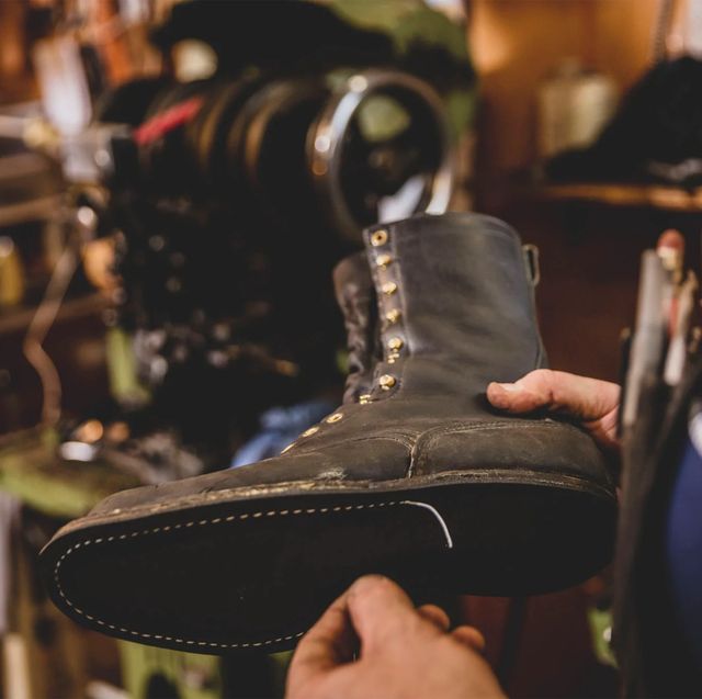man making a custom leather boot