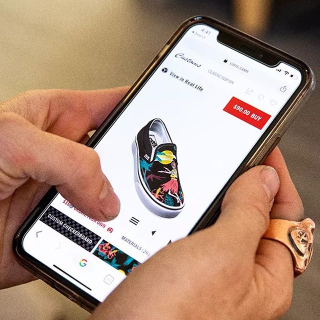 someone ordering custom shoes on vans mobile site