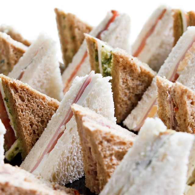cut platter of mixed  sandwich triangles