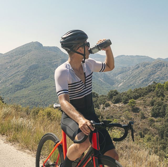 cyclist drinking from water bottle