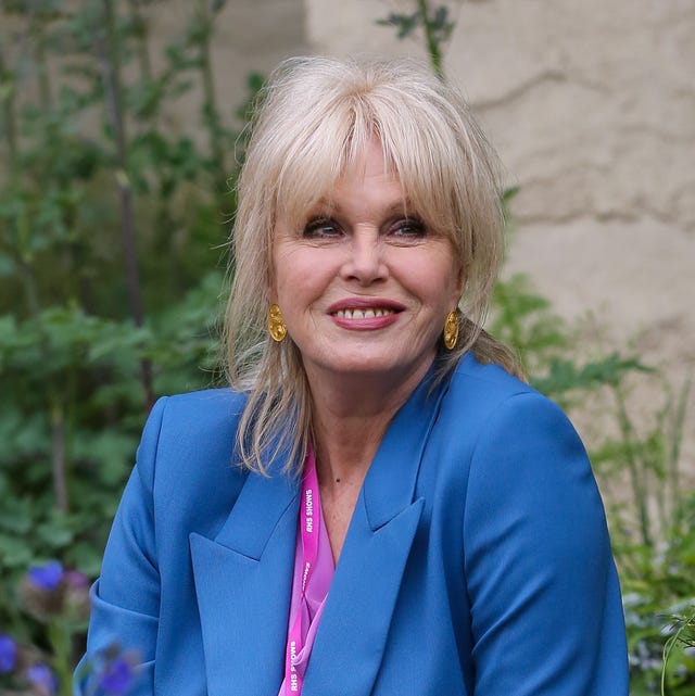 Dame Joanna Lumley looks effortlessly chic in blue satin suit