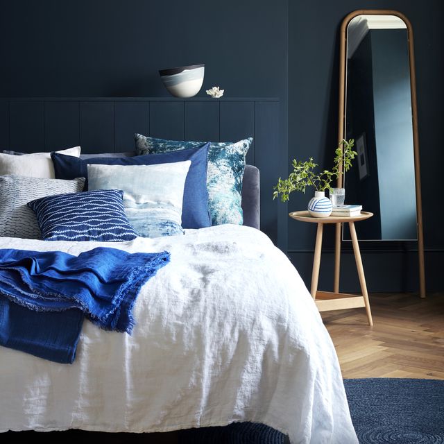 into the blue choose a breezy coastal inspired palette that ranges from calming cobalt to inky azure, tocreate a cool, comfortable look image shows a bedroom walls, as left chrome bed, £1,155,loaf cushions l r brera lino alabaster,£60, designers guild indigo, £95,baileys home kensu viridian, £145,black edition indigo shibori mokumecover, £75, ecosophy perfect day, £86,black edition wave shibori, £65, toastheavy linen throw in indigo, £145,toast vice versa linen throw in cobalt,£275 bud vase, £75 etienne tumbler,£12 all the conran shop stresa biancoduvet cover, £220, designers guildeden leaning mirror, £379 jute rug,£159 both heal’s clyde side table,£715, pinch blue cosmos vessel,£530, alison gautrey at jaggedartfaux coral plinth not shown, £75 fortwo, the big blue company