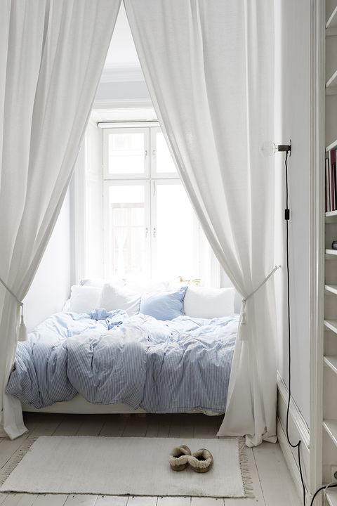 white and blue cozy bedroom