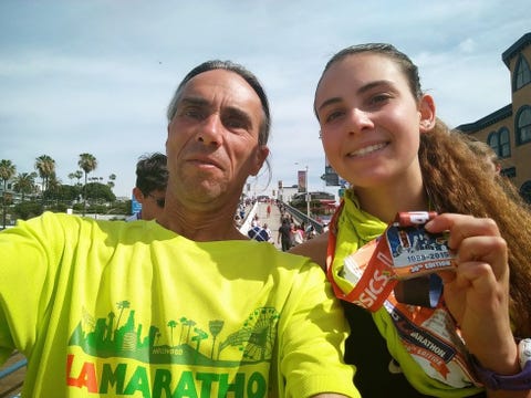 david simon with medal and young woman