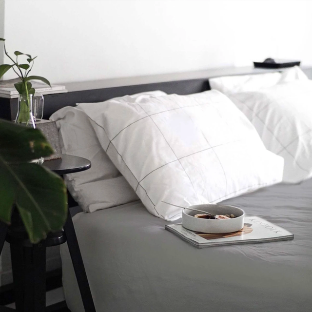 Brooklinen Classic Duvet Cover a bed with a gray duvet cover