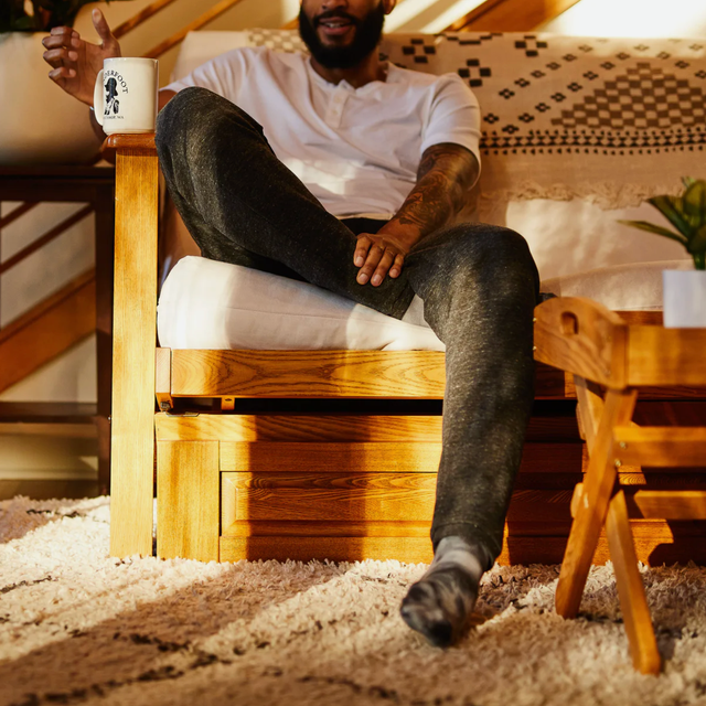 Deals-Not-To-Miss-November-12-Lead a model wearing sweatpants on a couch
