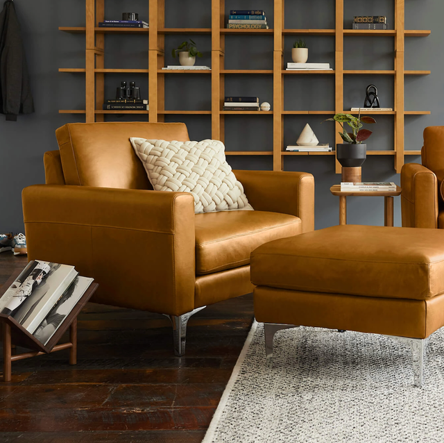 Burrow Block Nomad Club Chair a living room scene with brown leather couch, chair and ottoman