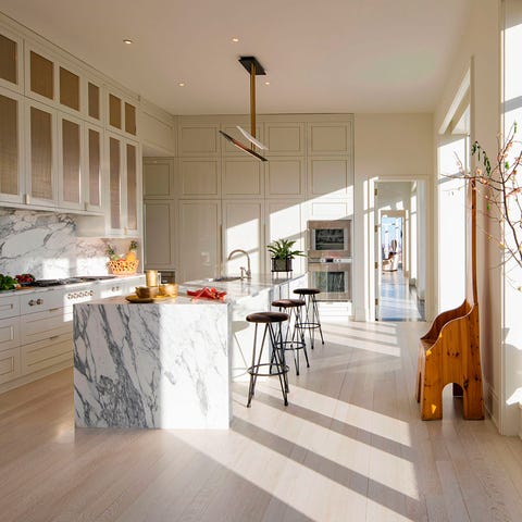 spare living area with floor to ceiling windows in a gallery view