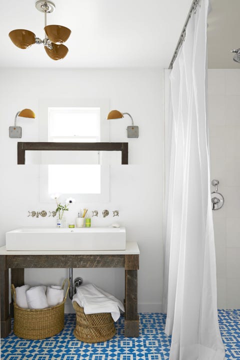 bathroom with baskets under sink