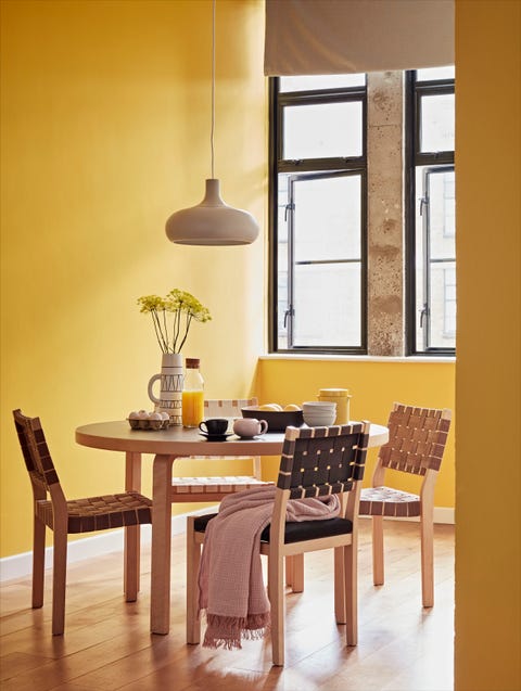 dining room with mustard walls