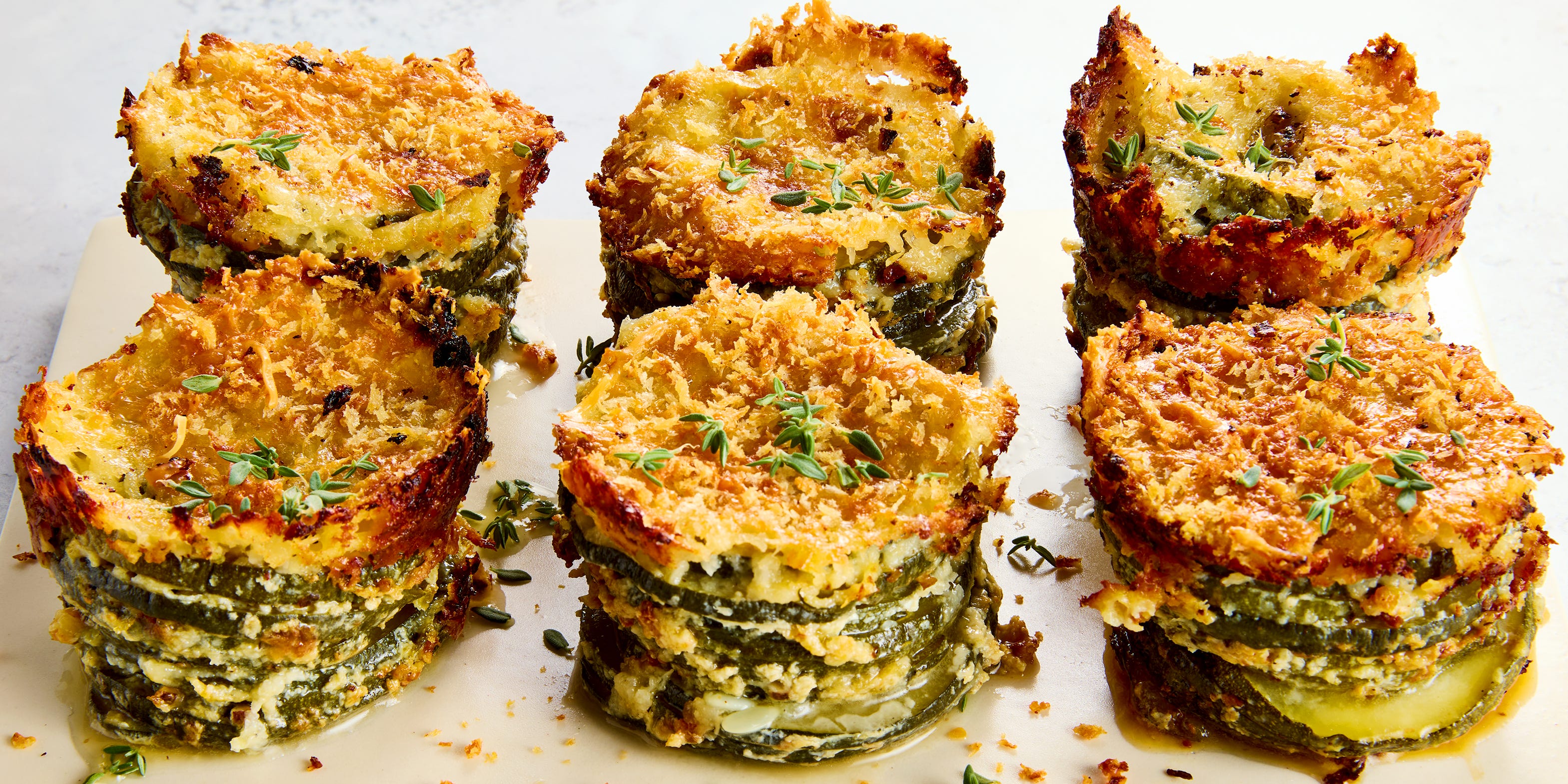 These Crispy, Cheesy Zucchini Stacks Taste Like A Summery Potato Gratin