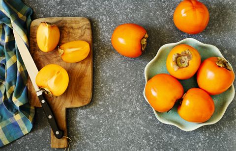 delicious fresh persimmon fruits on the table