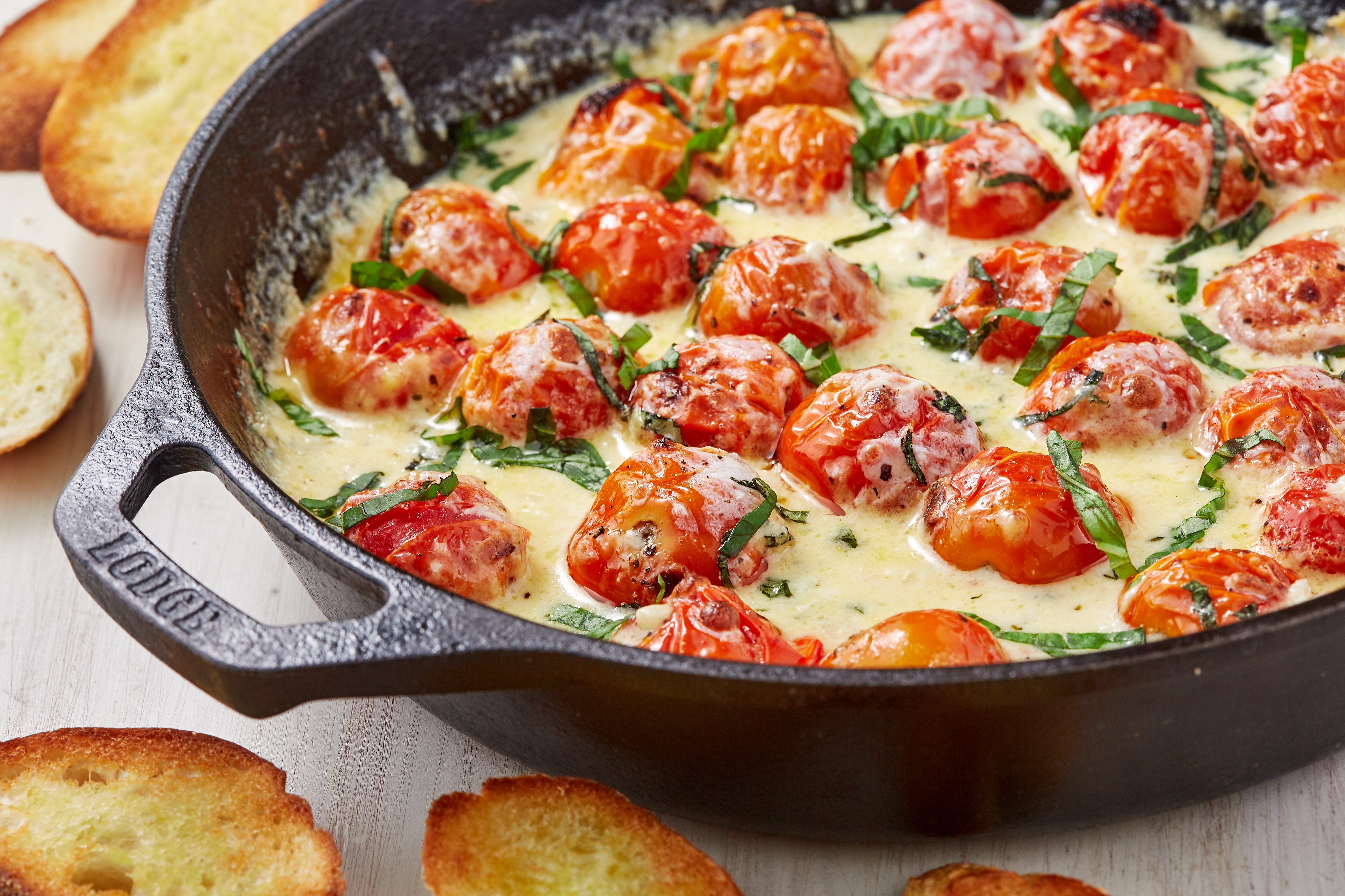 You're Going To Want A LOT Of Bread To Dip In This Cheesy Tomato Skillet