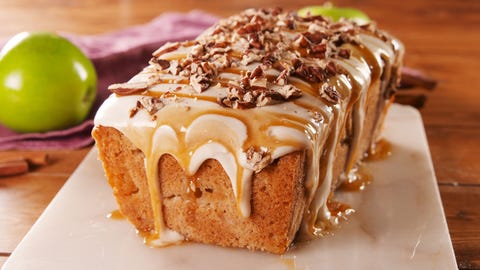 an apple pound cake with cream cheese frosting and caramel drizzle