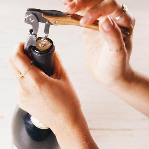 how to open a wine bottle with a key