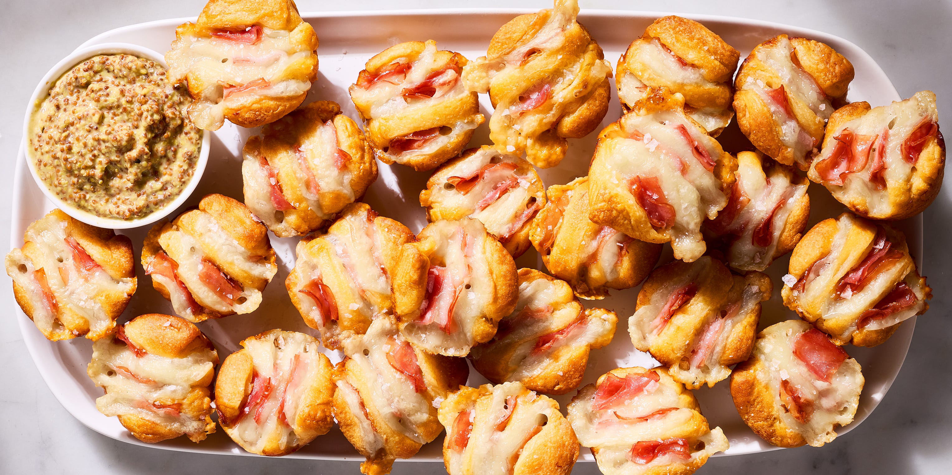 These Ham & Swiss Hasselback Biscuit Bites Will Run Potatoes Out Of Town