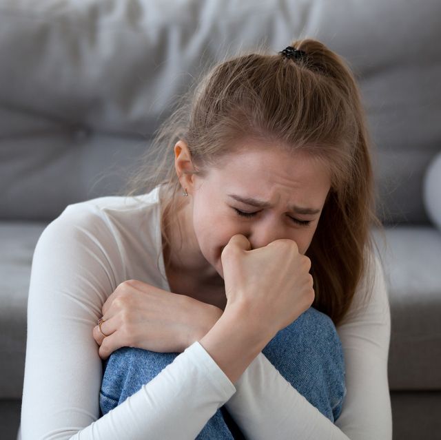desperate upset teen girl victim crying alone at home
