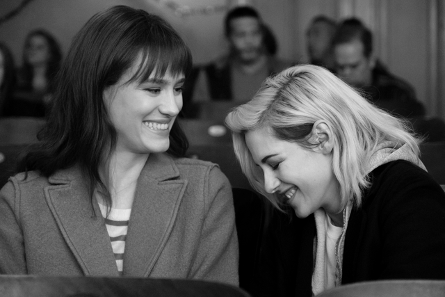 still from the happiest season movie   two women laughing