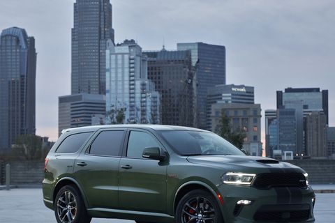 2021 dodge durango srt 392 equipped with the 392 cubic inch hemi v 8 delivering 475 horsepower and 470 lb ft of torque, the durango srt 392 features new aggressive exterior styling and a new interior with a driver centric cockpit, shown here in f8 green with dual low gloss gunmetal stripes