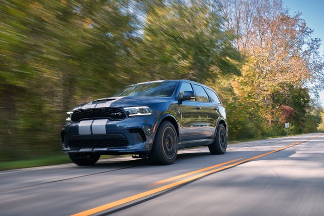 2021 dodge durango srt hellcat the most powerful suv ever features a new aggressive exterior, a new interior with a driver centric cockpit and delivers 710 horsepower, shown here in reactor blue with dual silver stripes