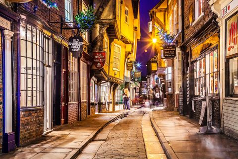 Christmas in The Shambles, the historic, medieval street in the old city centre of York at twilight.