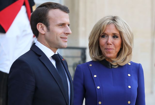 topshot   french president emmanuel macron l and his wife brigitte macron look on after accompanying back the chinese president and his wife following a meeting at the elysee palace in paris, on march 26, 2019, at the end of a state visit   the chinese president is on a  three day state visit to france where he is expected to sign a series of bilateral and economic deals on energy, the food industry, transport and other sectors photo by ludovic marin  afp        photo credit should read ludovic marinafp via getty images