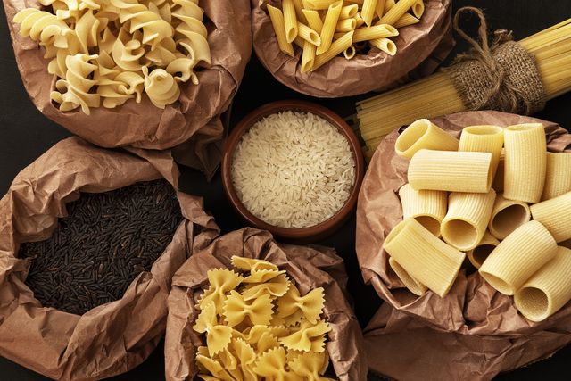different types of dry pasta and rice in recycling bags