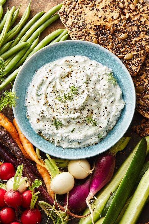 dill dip with vegetables and crackers