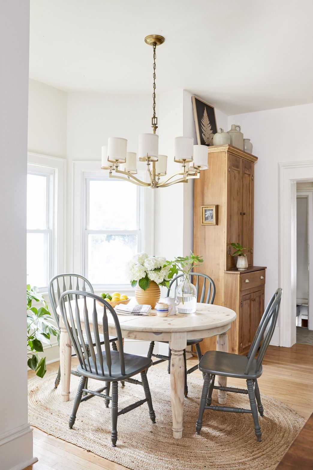 Dining Room Cabinets Ideas : Dining Room Cabinet Designs Design Cafe : Layered rugs beneath the table help delineate the dining area, while pastel walls make the room feel more expansive and inviting.