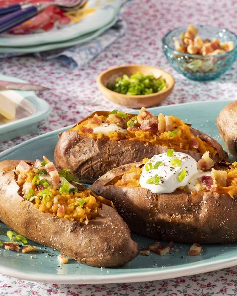 baked sweet potato with sour cream and bacon on top
