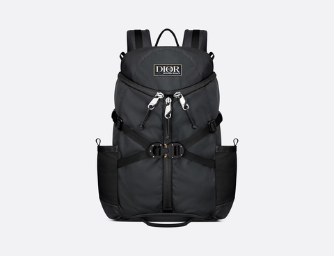 a black dior backpack with silver zippers