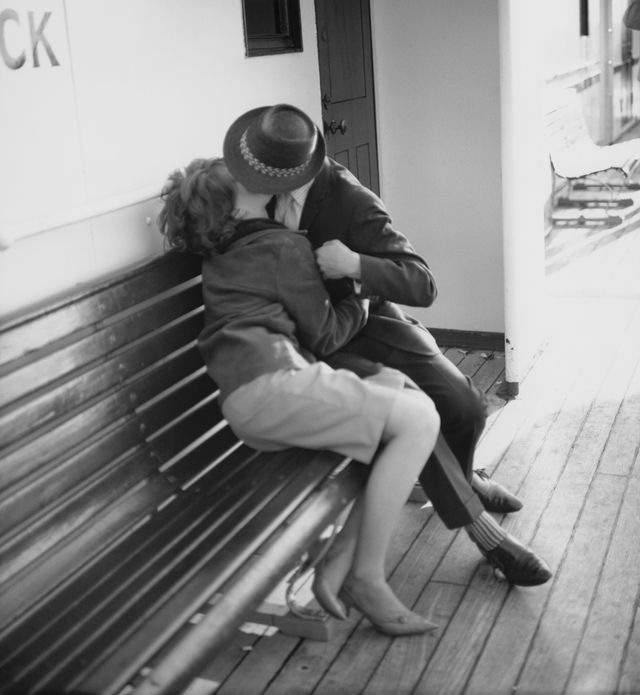 a young couple, wearing mod fashions, kissing on a bench, circa 1965 photo by david redfernredfernsgetty images