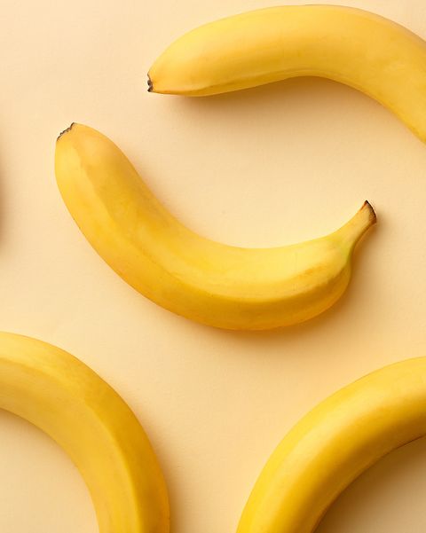 Directly Above Shot Of Bananas Over Beige Background