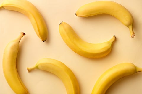 Directly Above Shot Of Bananas Over Beige Background