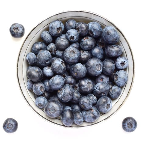Directly Above Shot Of Blueberries Over White Background
