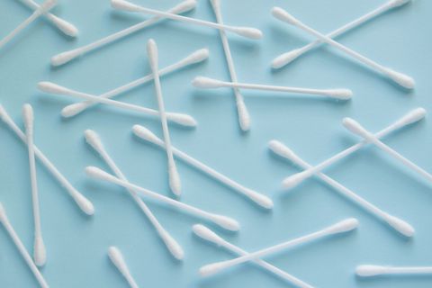 Directly Above Shot Of Cotton Swabs On Blue Backgrounds