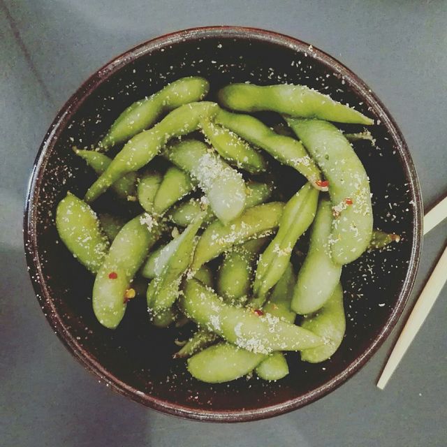 directly above shot of edamame beans in bowl on table
