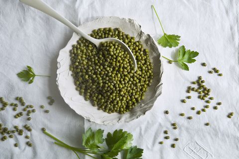 directly above shot of mung beans in plate on tablecloth