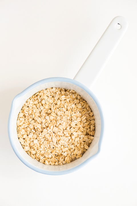 Directly Above Shot Of Oats In Bowl On White Background Directly Above Shot Of Oats In Bowl On White Background