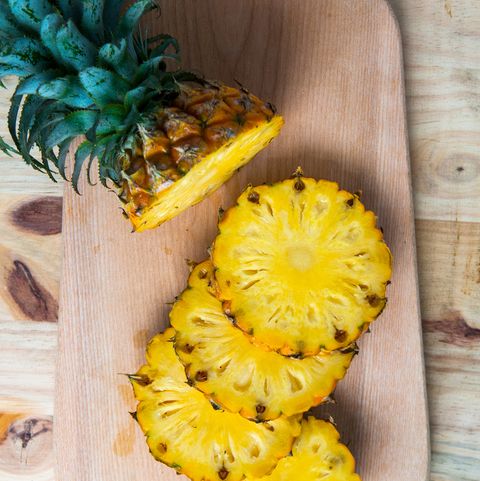 Directly Above Shot Of Pineapple Slices On Cutting Board