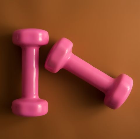 Directly Above Shot Of Pink Dumbbells On Brown Background