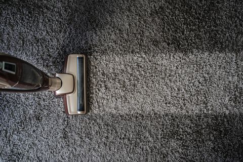 directly above shot of vacuum cleaner on carpet