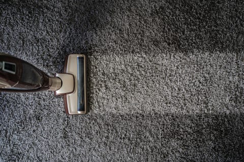 Directly Above Shot Of Vacuum Cleaner On Carpet directly above shot of vacuum cleaner on carpet