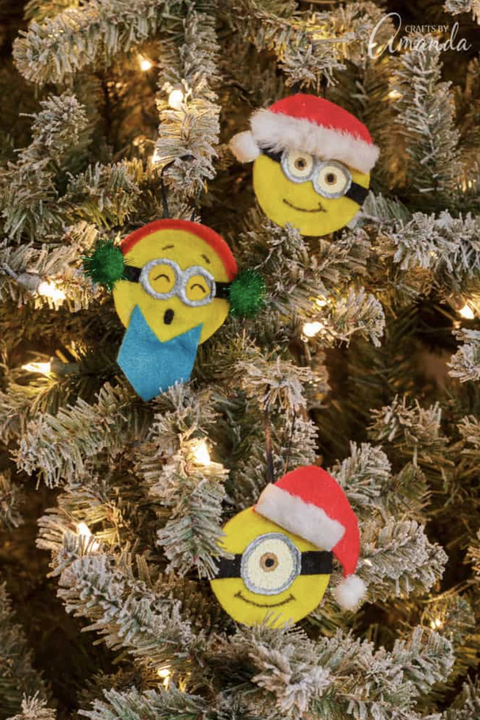 diy christmas ornaments, minion ornaments on snow flocked tree