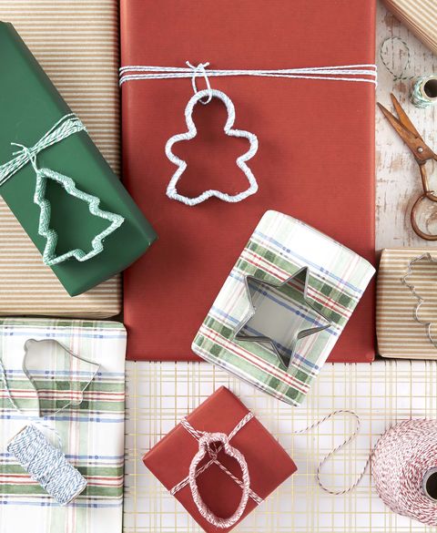 a solid back vintage cookie cutter turned into a christmas ornament by filling the inside with vintage christmas notions